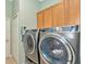 Convenient laundry room with a washer and dryer at 11220 Paradise Point Way, New Port Richey, FL 34654