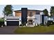 Two-story modern home with attached garage and landscaped lawn at 1810 W Erna Dr, Tampa, FL 33603