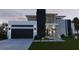 Two story modern home with attached garage and landscaping at 1810 W Erna Dr, Tampa, FL 33603
