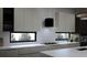 Modern kitchen with stainless steel appliances and breakfast bar at 1810 W Erna Dr, Tampa, FL 33603