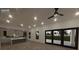 Open concept living area with kitchen and sliding glass doors at 1810 W Erna Dr, Tampa, FL 33603