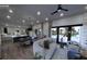 Open living room with modern furniture and view of the pool at 1810 W Erna Dr, Tampa, FL 33603