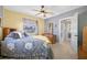 Bedroom with a queen-size bed and ceiling fan at 2801 Gulf Blvd, Belleair Beach, FL 33786