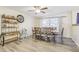 Dining room with wood flooring and a rustic dining set at 3407 King George Ln, Seffner, FL 33584
