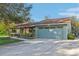 House exterior with light teal garage at 3407 King George Ln, Seffner, FL 33584
