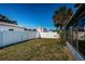 Large backyard with grass, fence, and palm trees at 4051 30Th N Ave, St Petersburg, FL 33713