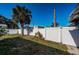 Landscaped backyard with a white fence and slide at 4051 30Th N Ave, St Petersburg, FL 33713