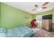 Bedroom with a bed, desk, and ceiling fan at 4051 30Th N Ave, St Petersburg, FL 33713