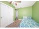 Small bedroom with a twin bed and double door closet at 4051 30Th N Ave, St Petersburg, FL 33713