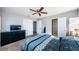 Main bedroom with a queen bed, dresser, and ceiling fan at 4051 30Th N Ave, St Petersburg, FL 33713