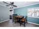 Bright dining area with a table and chairs, wood-look tile floors, and light blue walls at 4051 30Th N Ave, St Petersburg, FL 33713