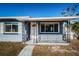 Quaint front porch with wrought-iron railings and white door at 4051 30Th N Ave, St Petersburg, FL 33713