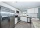 Updated kitchen with white cabinets, granite countertops, and stainless steel appliances at 4051 30Th N Ave, St Petersburg, FL 33713