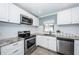 Bright kitchen, featuring stainless steel appliances and granite countertops at 4051 30Th N Ave, St Petersburg, FL 33713