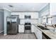 Modern kitchen featuring stainless steel appliances and granite countertops at 4051 30Th N Ave, St Petersburg, FL 33713