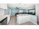 Open concept kitchen and dining area with granite island and ceiling fan at 4051 30Th N Ave, St Petersburg, FL 33713