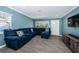 Spacious living room with sectional sofa and wood-look tile flooring at 4051 30Th N Ave, St Petersburg, FL 33713