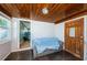 Cozy sunroom features a covered couch and wood ceiling at 4051 30Th N Ave, St Petersburg, FL 33713