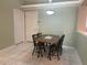 Cozy dining area with tile floor and neutral paint, next to back and side door at 1105 Savannah Landings Ave, Valrico, FL 33596