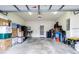 Spacious garage with ample storage space, featuring a concrete floor and white walls, ideal for organization and projects at 1105 Savannah Landings Ave, Valrico, FL 33596