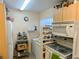 Well-equipped kitchen with a microwave, stove, and refrigerator at 24862 Us Highway 19 N # 3001, Clearwater, FL 33763