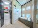 Elegant bathroom with freestanding tub and walk-in closet at 2711 W Trilby Ave, Tampa, FL 33611