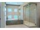 Luxurious bathroom with soaking tub and glass shower at 2711 W Trilby Ave, Tampa, FL 33611