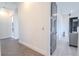 Bright hallway with hardwood floors and access to other rooms at 2711 W Trilby Ave, Tampa, FL 33611