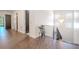 Bright hallway with hardwood floors and modern metal railing at 2711 W Trilby Ave, Tampa, FL 33611