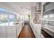 Modern kitchen with white cabinets, marble countertops and stainless steel appliances at 2711 W Trilby Ave, Tampa, FL 33611