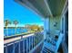 Balcony with rocking chairs and stunning water views at 611 Destiny Dr # 207, Ruskin, FL 33570