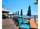 Beachfront bar with turquoise chairs and umbrellas at 611 Destiny Dr # 207, Ruskin, FL 33570