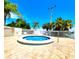 Relaxing community hot tub with palm trees in background at 611 Destiny Dr # 207, Ruskin, FL 33570