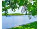 Scenic waterfront view with calm water and lush greenery at 611 Destiny Dr # 207, Ruskin, FL 33570