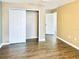 Simple bedroom with wood floors and a large closet at 9107 Lingrove Rd, Weeki Wachee, FL 34613