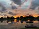 Scenic sunset view over calm lake water at 9107 Lingrove Rd, Weeki Wachee, FL 34613