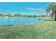 Peaceful lakefront property with lush grass at 9107 Lingrove Rd, Weeki Wachee, FL 34613