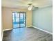 Living room with sliding glass doors leading to patio at 9107 Lingrove Rd, Weeki Wachee, FL 34613