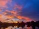 Stunning sunset over the lake with clouds at 9107 Lingrove Rd, Weeki Wachee, FL 34613