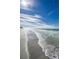 Ocean waves gently lapping on a sandy beach at 1390 Gulf Blvd # Ph-1, Clearwater Beach, FL 33767