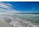 Stunning ocean waves rolling onto a pristine sandy beach at 1390 Gulf Blvd # Ph-1, Clearwater Beach, FL 33767