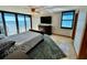 Main bedroom with ocean view and large TV at 1390 Gulf Blvd # Ph-1, Clearwater Beach, FL 33767