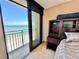 Bedroom with sliding doors to balcony and ocean view at 1390 Gulf Blvd # Ph-1, Clearwater Beach, FL 33767