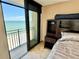 Bedroom with sliding doors to balcony and ocean view at 1390 Gulf Blvd # Ph-1, Clearwater Beach, FL 33767