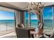 Oceanfront dining room with a table for four and breathtaking views at 1390 Gulf Blvd # Ph-1, Clearwater Beach, FL 33767