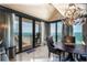 Elegant dining room with ocean views and modern chandelier at 1390 Gulf Blvd # Ph-1, Clearwater Beach, FL 33767