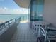 Relaxing balcony featuring tile floors, patio furniture, and stunning ocean views at 1540 Gulf Blvd # 2107, Clearwater Beach, FL 33767