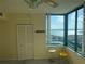 Bedroom with a view of the water, a chair, and a closet at 1540 Gulf Blvd # 2107, Clearwater Beach, FL 33767