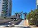 Elegant entrance leading to condo buildings with tall palm trees at 1540 Gulf Blvd # 2107, Clearwater Beach, FL 33767