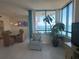 Inviting living area features ocean views, tiled floors, large windows and comfortable furniture at 1540 Gulf Blvd # 2107, Clearwater Beach, FL 33767